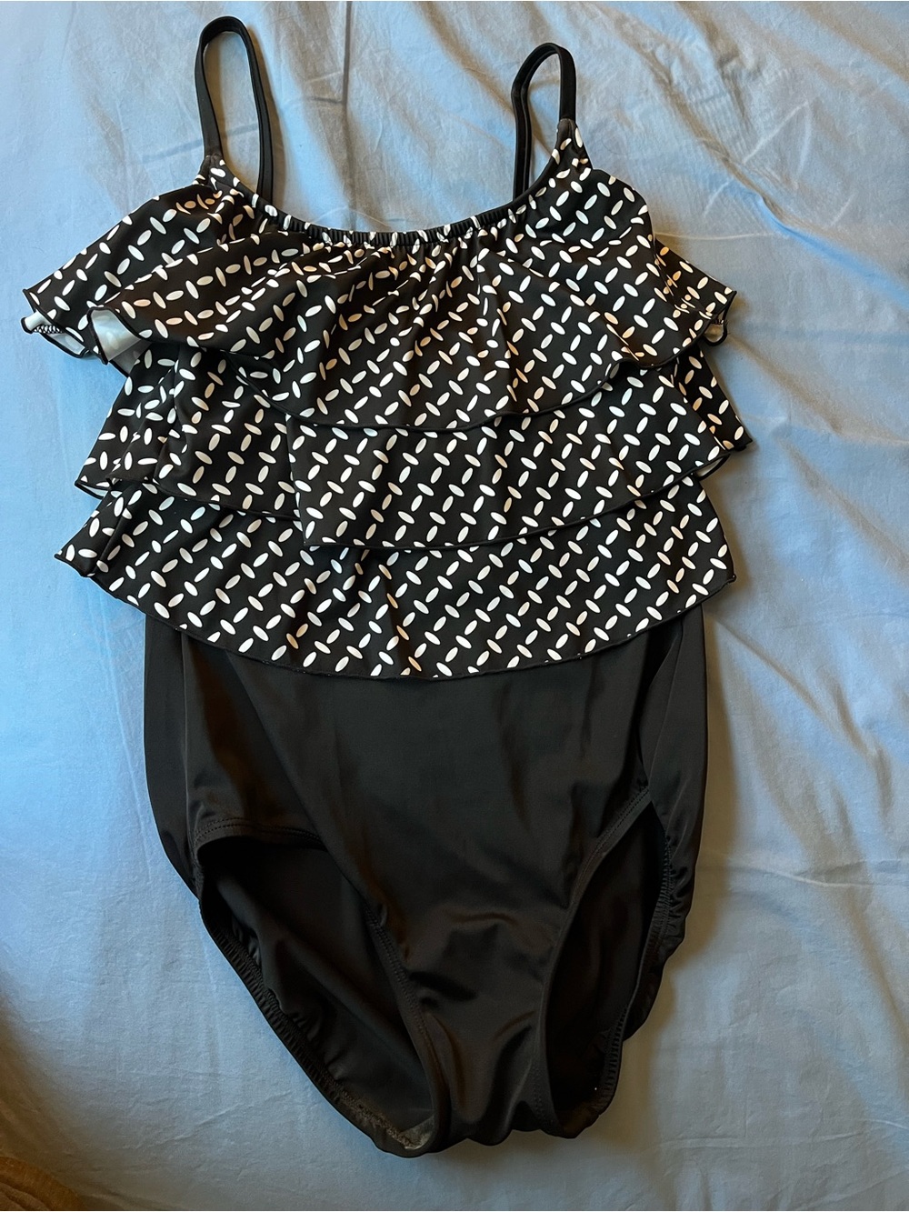 Women’s Black One-Piece Swimsuit with White Print ruffles over chest. Size 14